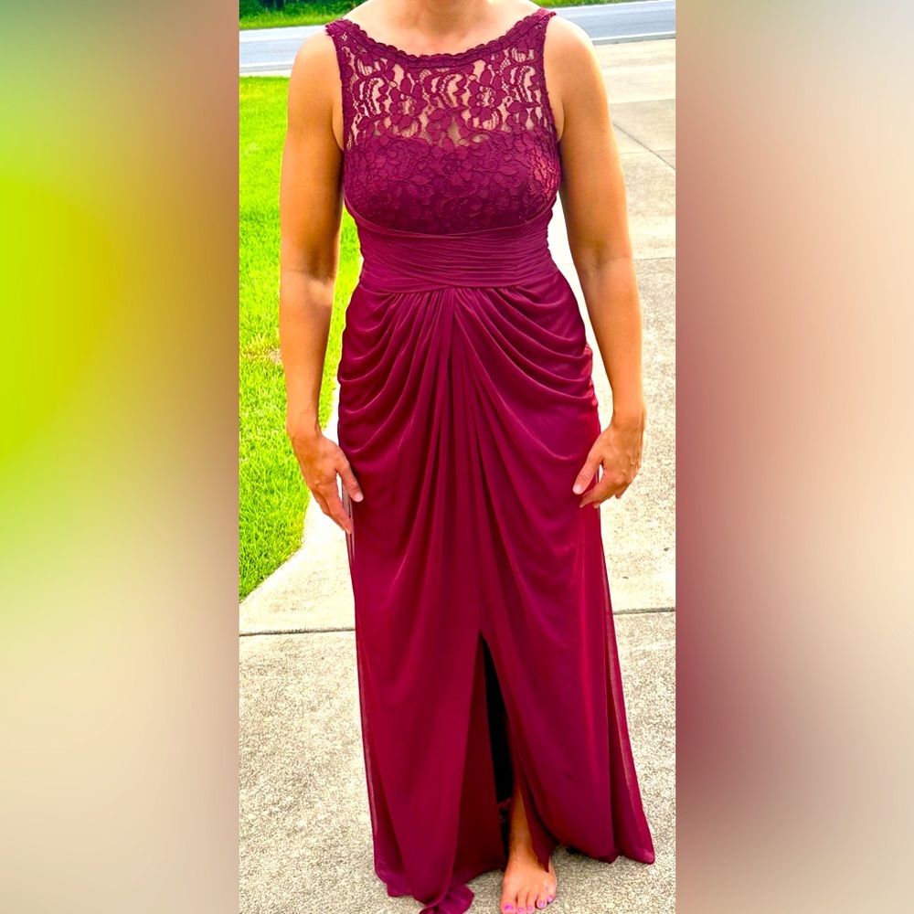 Burgundy sleeveless long formal dress. Lace detailing. Lined sweetheart neckline